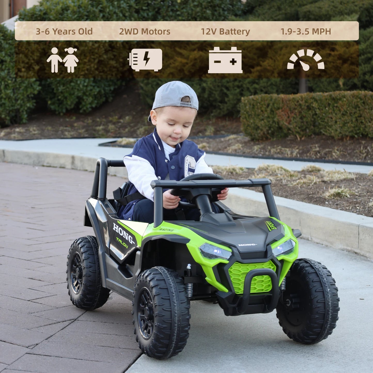 Child playing with a green and black toy car on a sidewalk