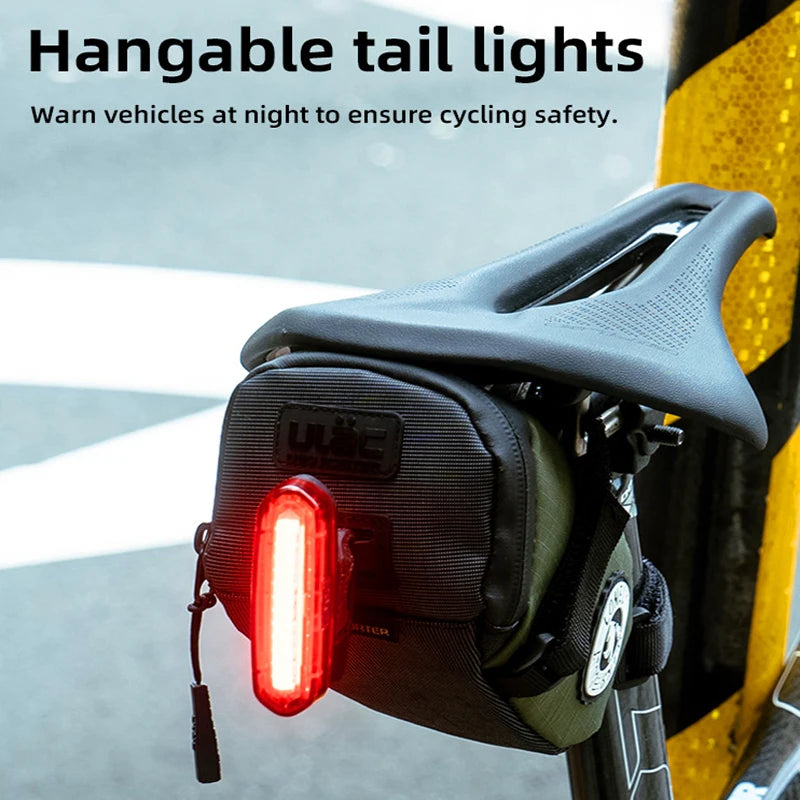 Bicycle tail light attached to a bike seat with text about safety.