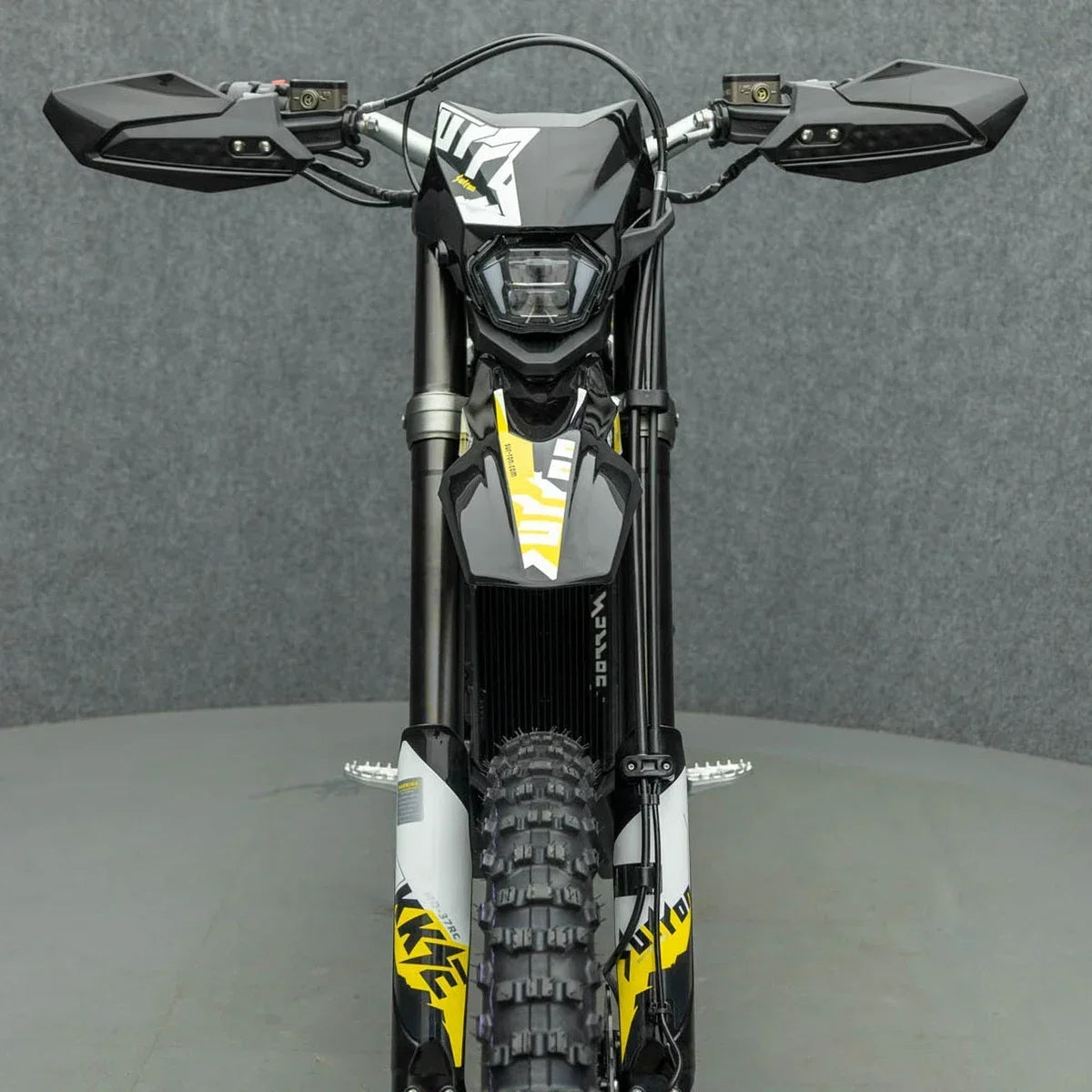 Upgrade your SURRON Ultra Bee with the Original Black Front Fender, Mudguard, Headlight Shroud, Skid Plate Brackets, and Brush Guards. Shop now at electricbikesandaccessories.com.