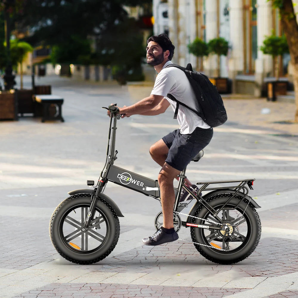 Man riding IDOTATA 1000W Electric Bike with 20-inch fat tires in an urban setting.