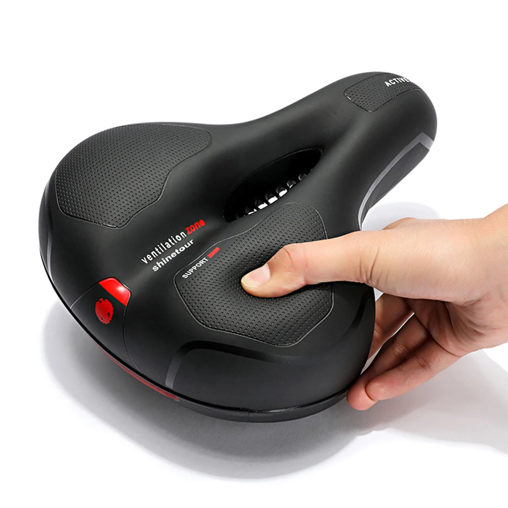 Hollow breathable e-bike saddle with big butt comfort, shock absorption, and reflective safety—ideal for men and women.